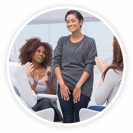 women talking in a group setting