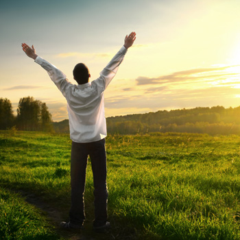 person stretching in sunshine