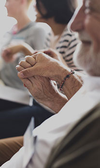 Close-up of two people holding hands